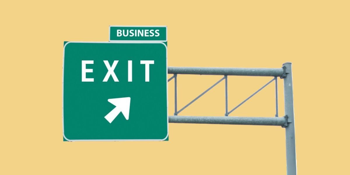 A gold-yellow background color. An image of a highway exit sign is in the middle, with the words 