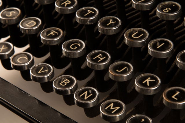 old manual typewriter keyboard representing storytelling tools